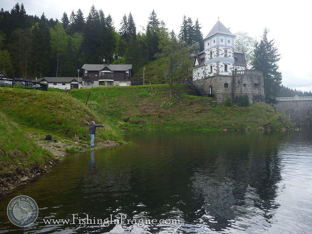 Lake fly fishing - castle near the water Lake fly fishing - castle near the water