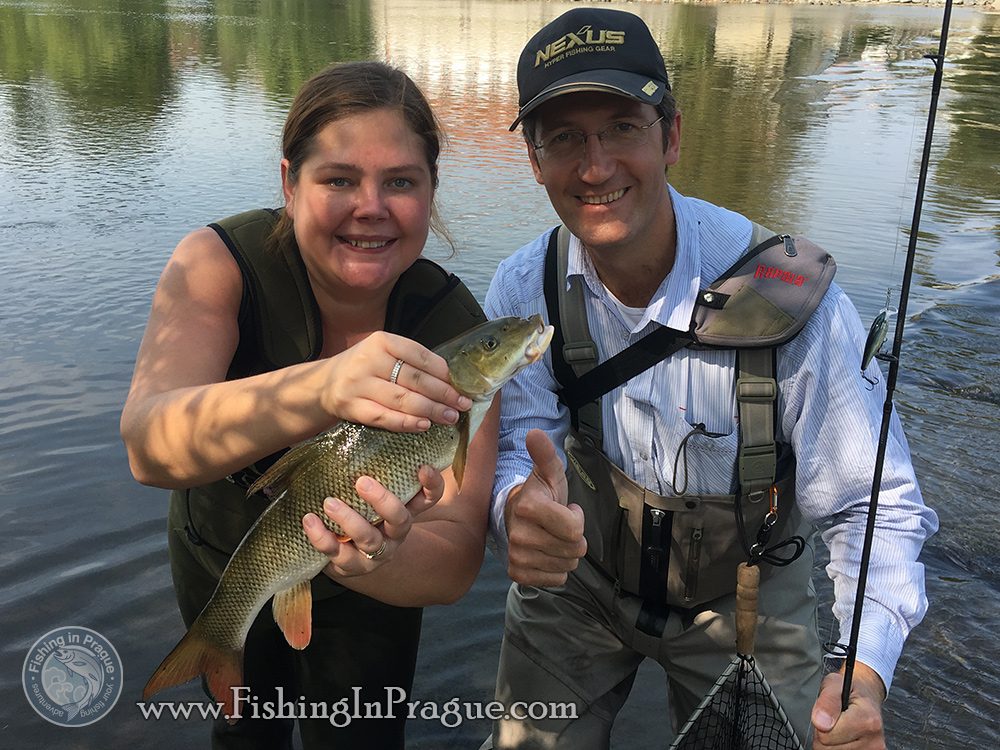 Happy angler with the same happy barbel